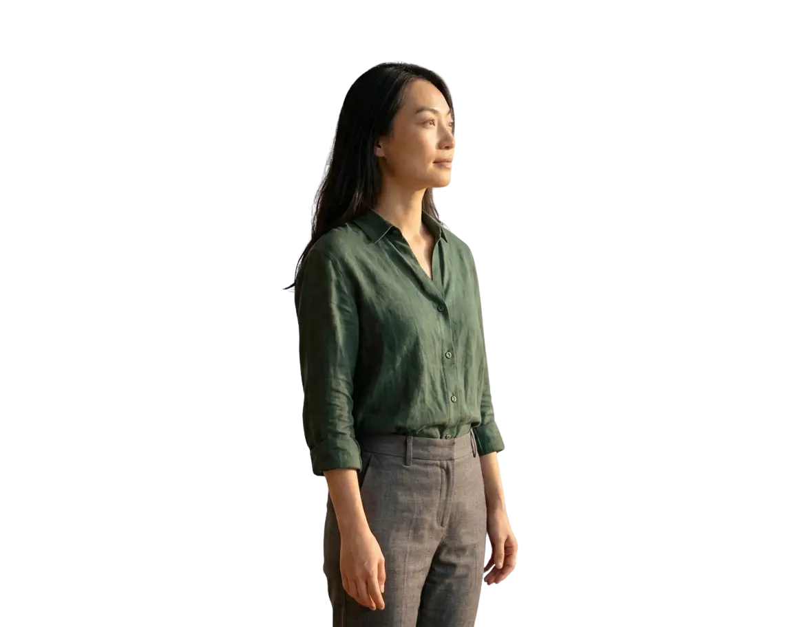 A woman standing calmly with quiet determination